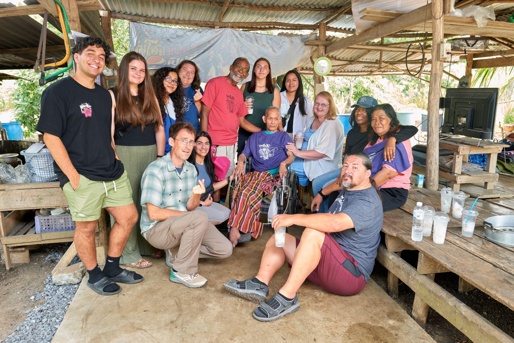 Group photo of WWU volunteers and the local Thai farming family